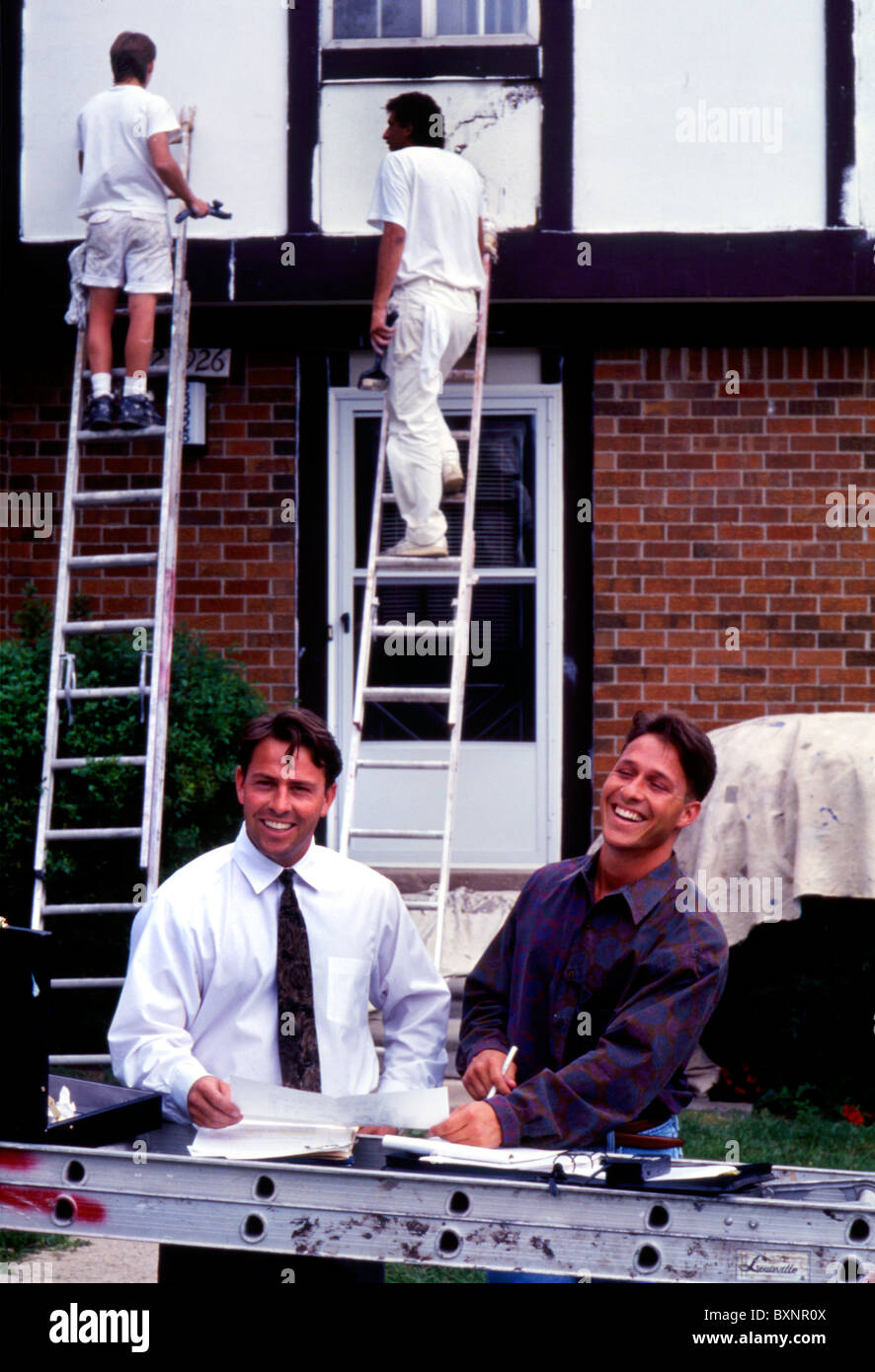 House painting business owners on job site Stock Photo Alamy