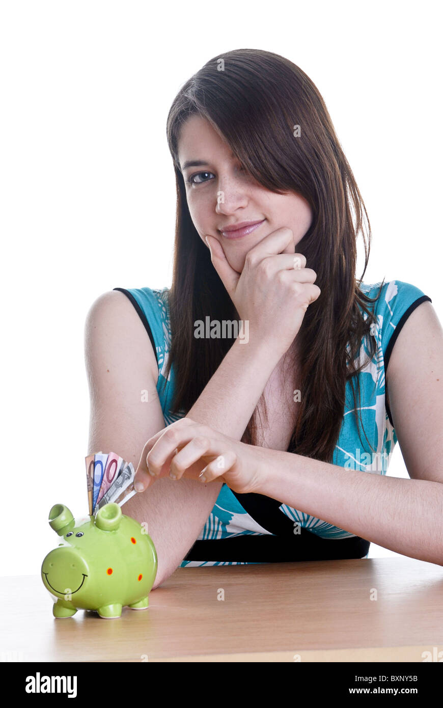 Young woman with her piggy bank Stock Photo