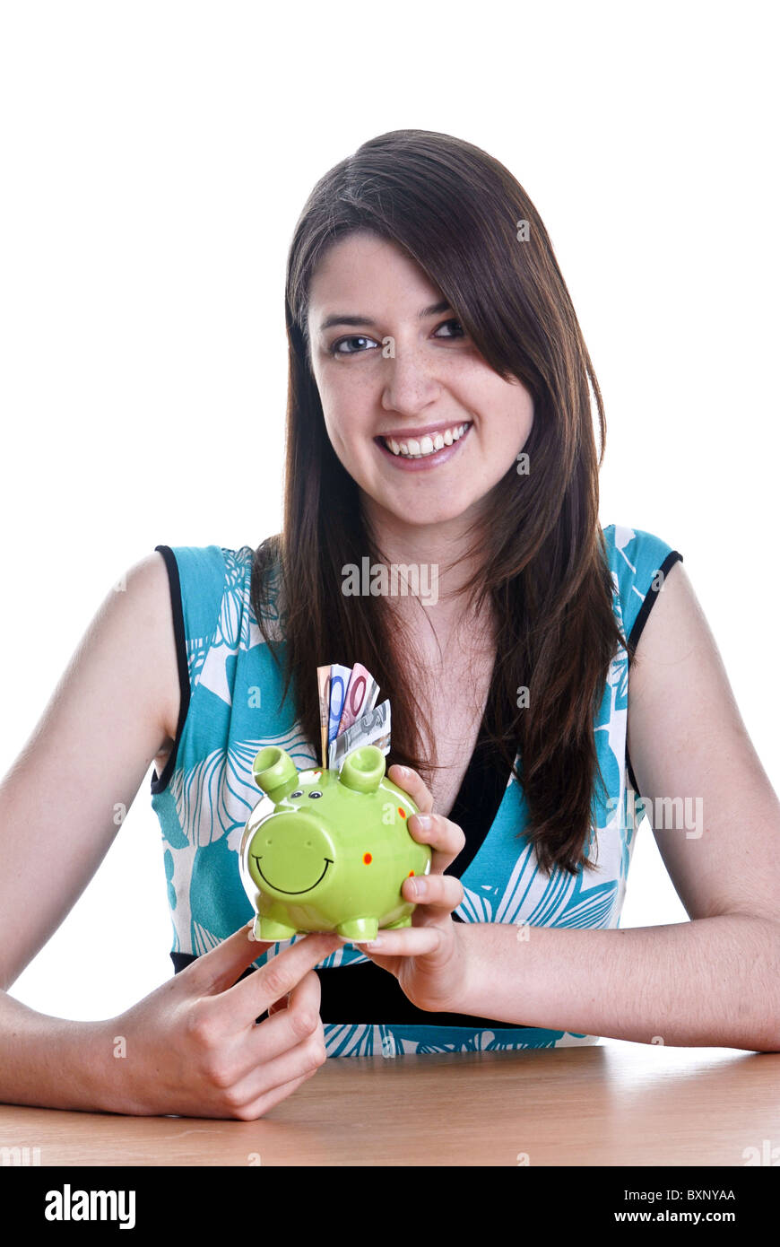 Young woman with her piggy bank Stock Photo