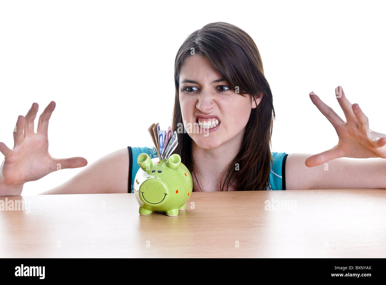 Young woman with her piggy bank Stock Photo