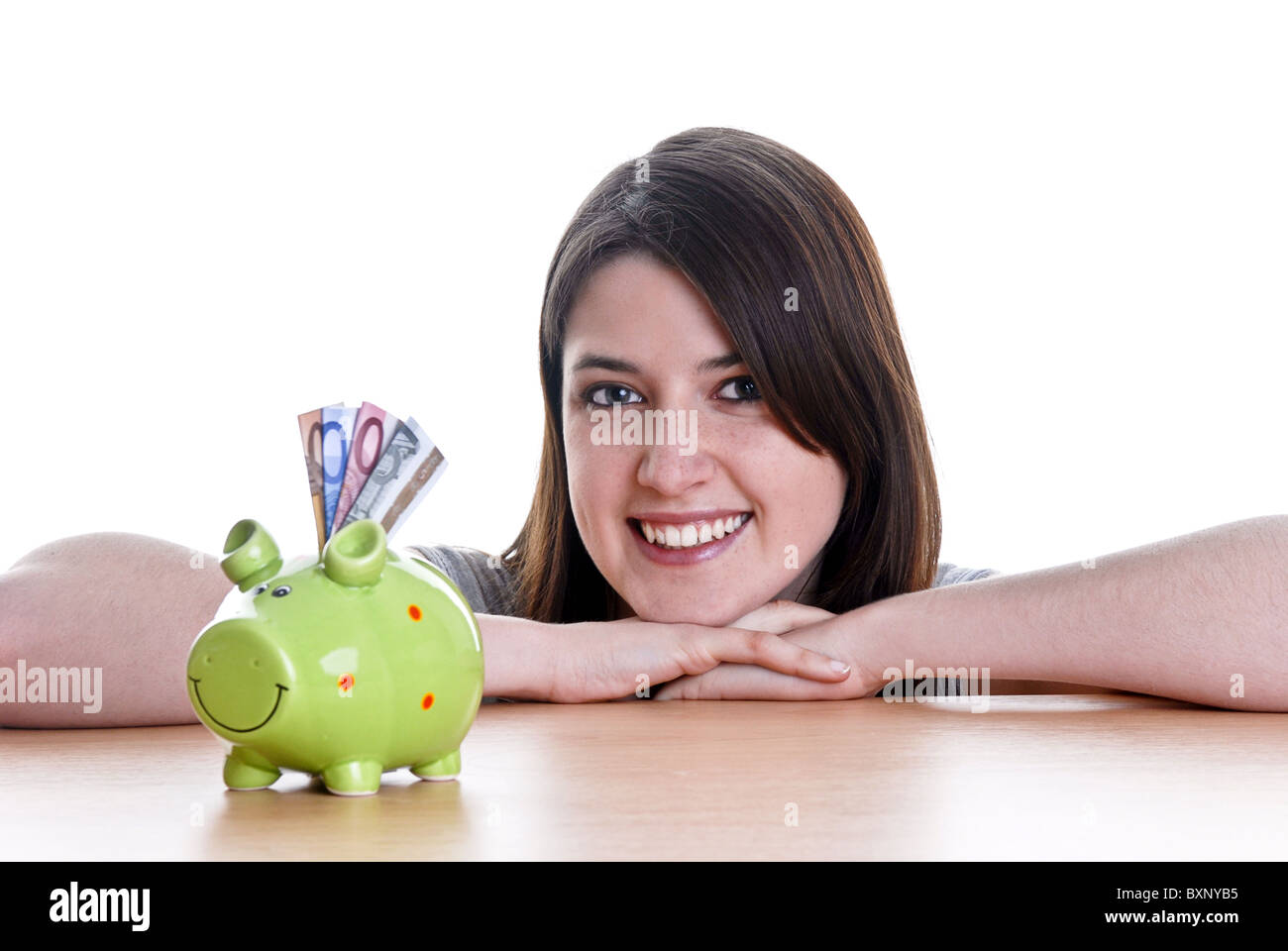 Young woman with her piggy bank Stock Photo