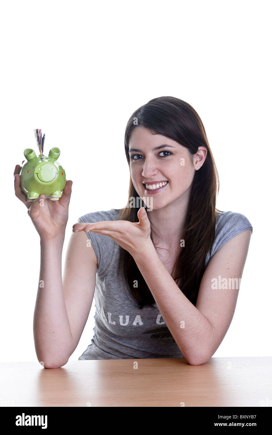 Young woman with her piggy bank Stock Photo