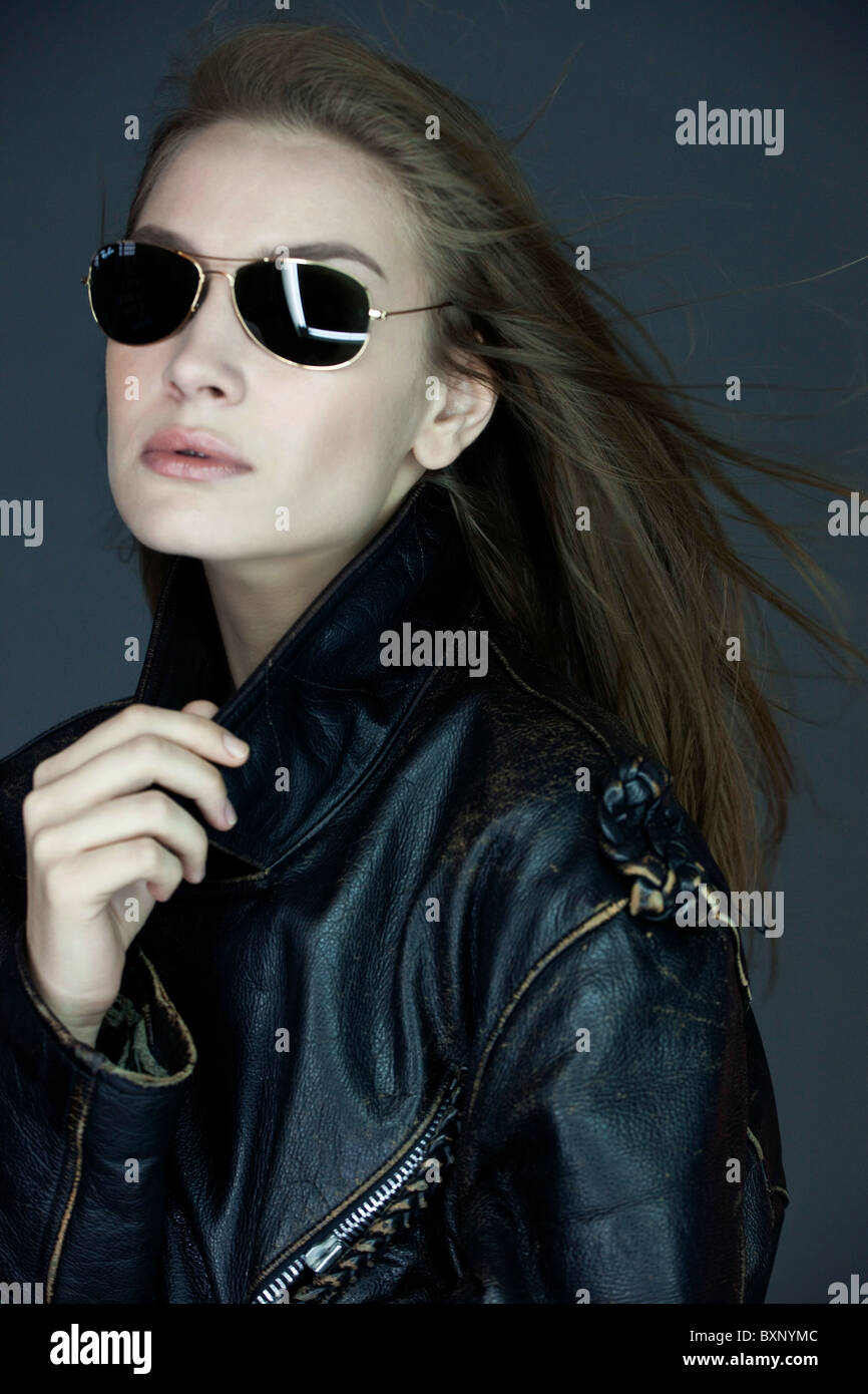 western woman in leather jacket with sunglasses Stock Photo - Alamy