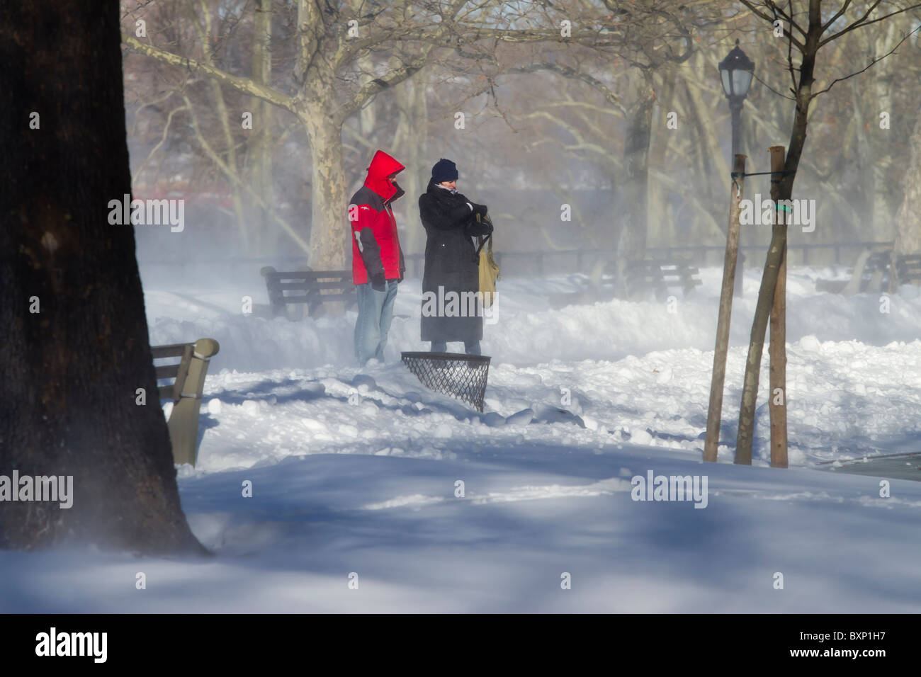 Wind gusts of up to 50 mph blow snow from a late December blizzard into drifts in Riverside Park Stock Photo