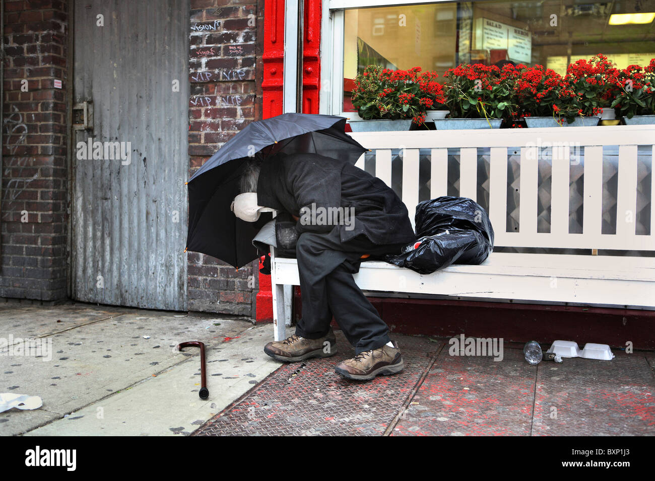 A man sleeping on a bench, New York City, USA Stock Photo - Alamy