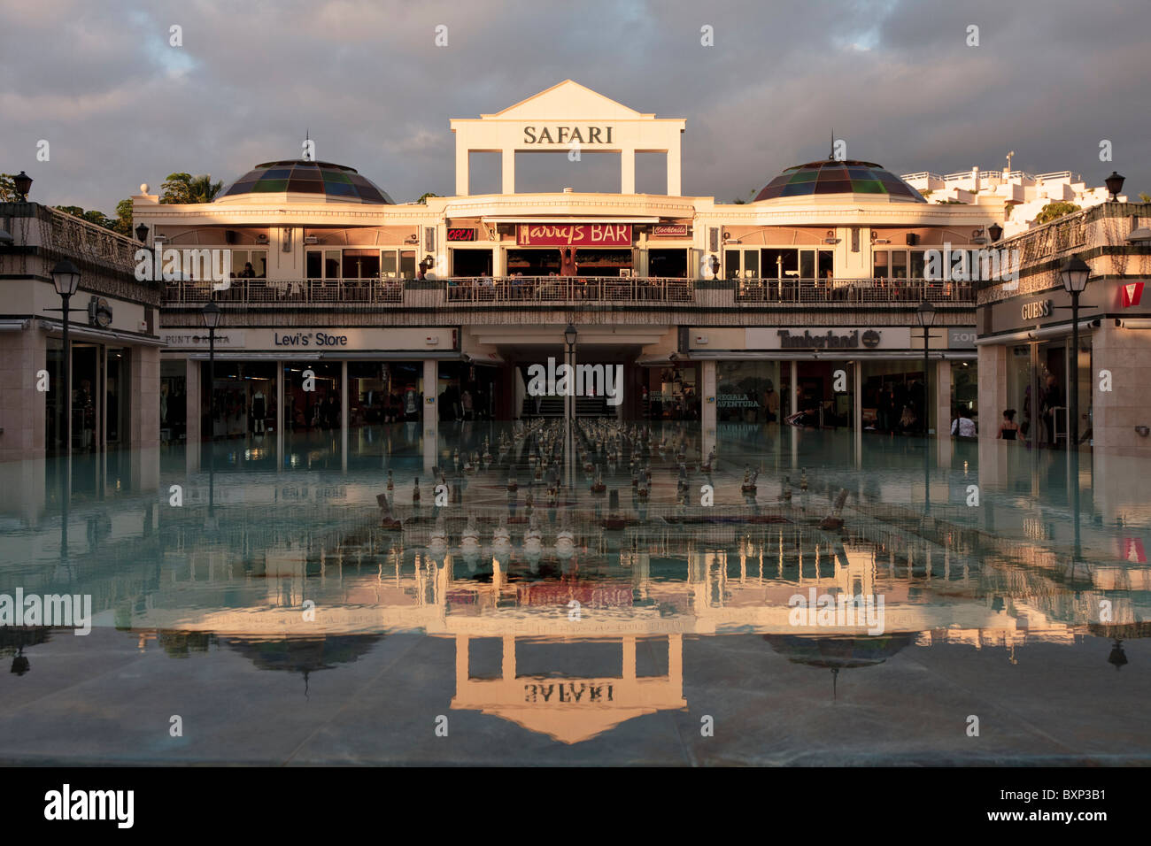 Safari shopping centre and Harrys Bar reflected in the fountain in the  centre Las Americas Tenerife Canary Islands Spain Stock Photo - Alamy