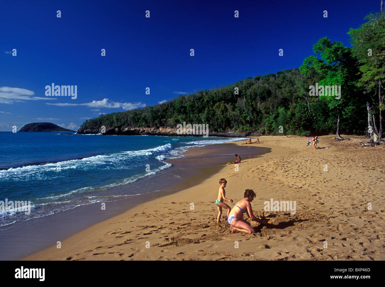 adult woman, young boy, mother and son, Anse de la Perle, beach, near town of Deshaies, Basse-Terre Island, Guadeloupe, French West Indies, France Stock Photo
