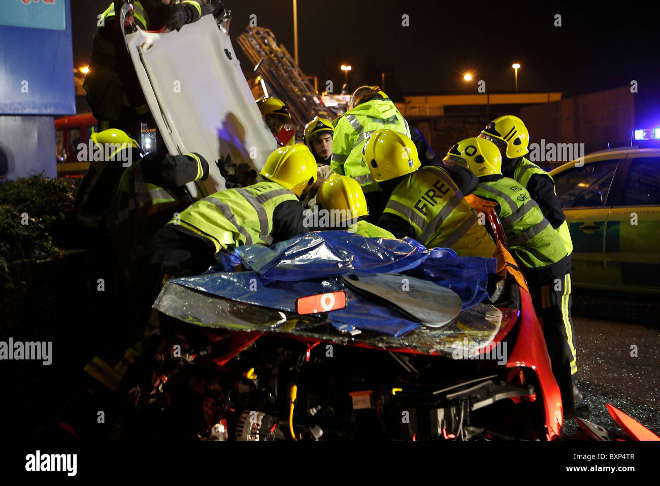 Spinal board being used at a crash scene Stock Photo