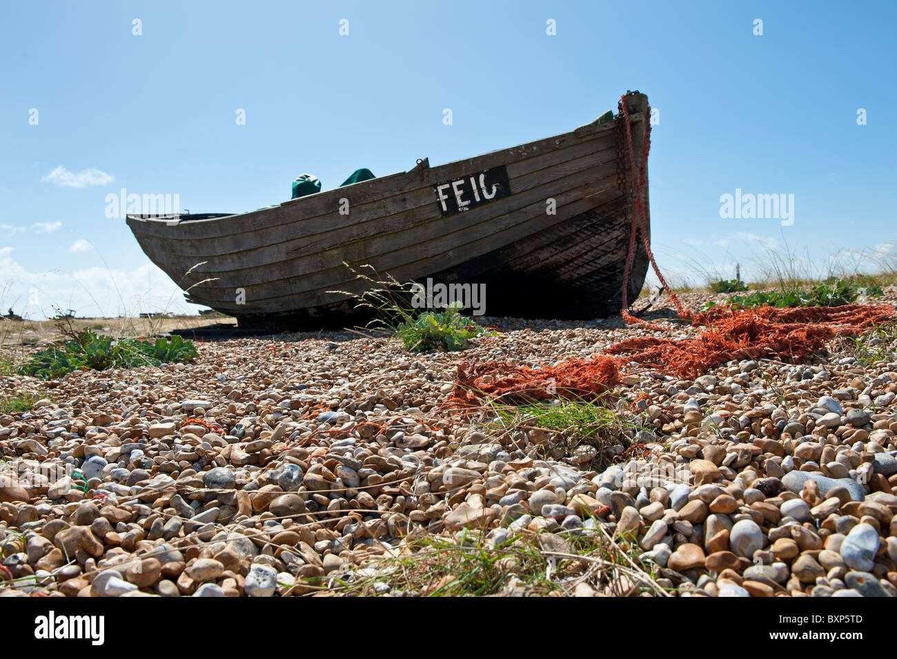Abandoned old wooden boat on Dungerness shingle and pebble beach Stock ...