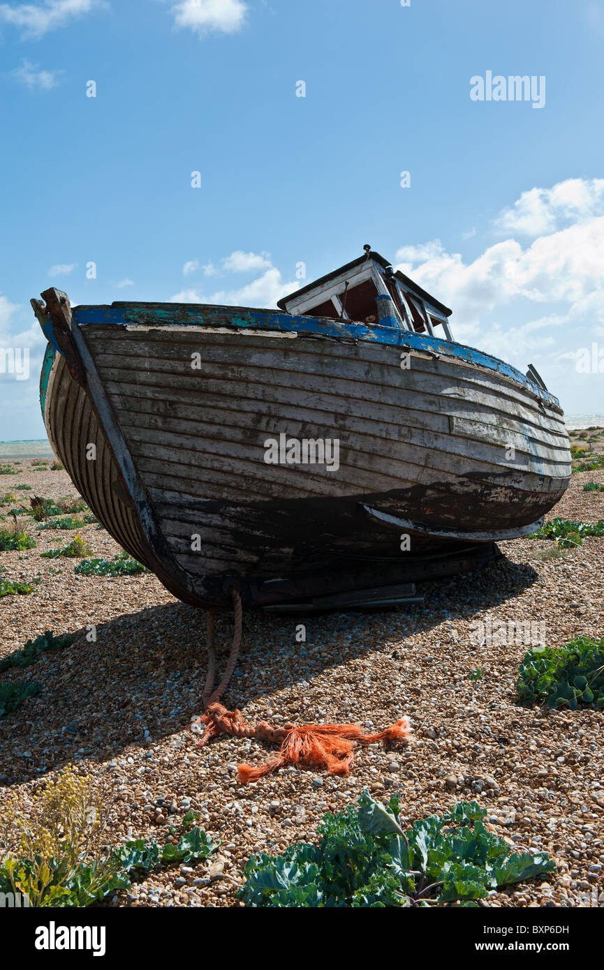 Abandoned old wooden boat on Dungerness shingle and pebble beach Stock ...