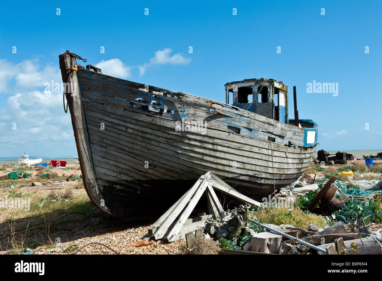 Abandoned old wooden boat on Dungerness shingle and pebble beach Stock ...