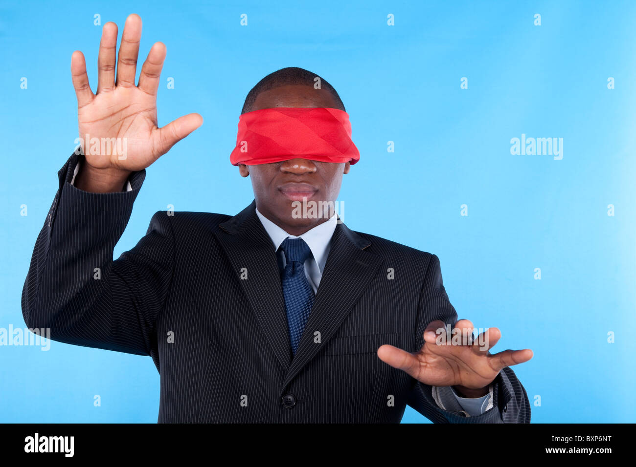 Person hand threatening a blindfolded businessman Stock Photo - Alamy