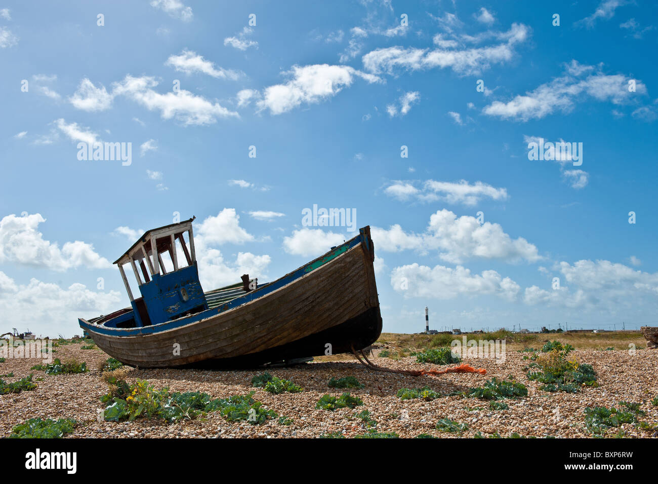 Abandoned old wooden boat on Dungerness shingle and pebble beach Stock ...