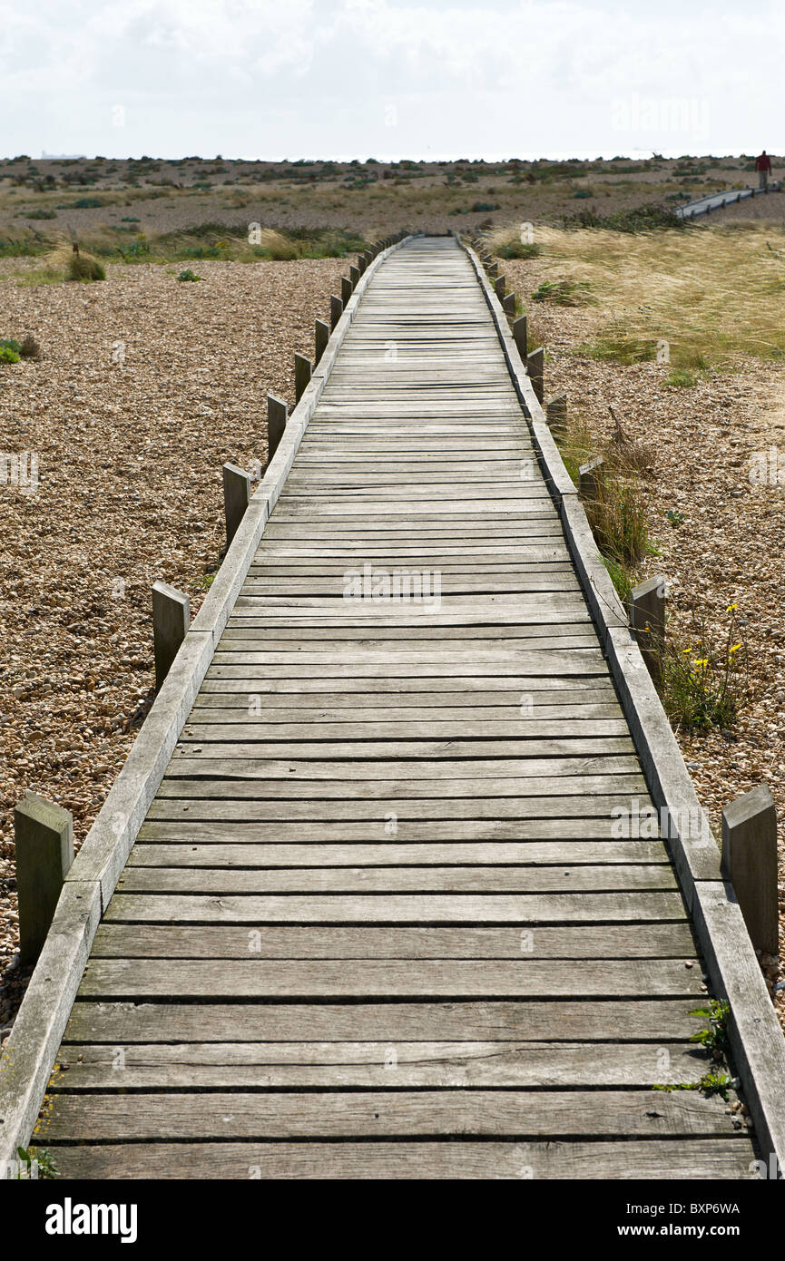 Wooden Boardwalk on a shingle beach Dungerness Kent Stock Photo