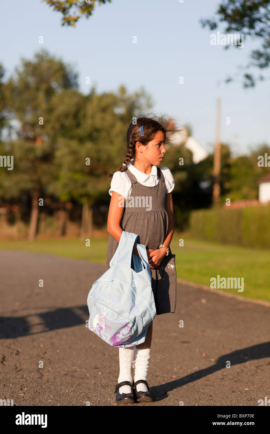 girl walking home from school Stock Photo Alamy