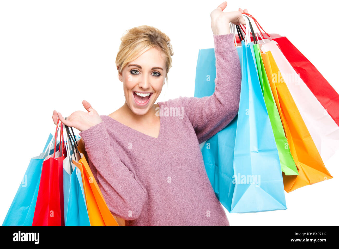 Attractive Young Blond Woman Carrying Lots of Multi-Colored Shopping Bags  Looking Happy and Excited Stock Photo - Alamy