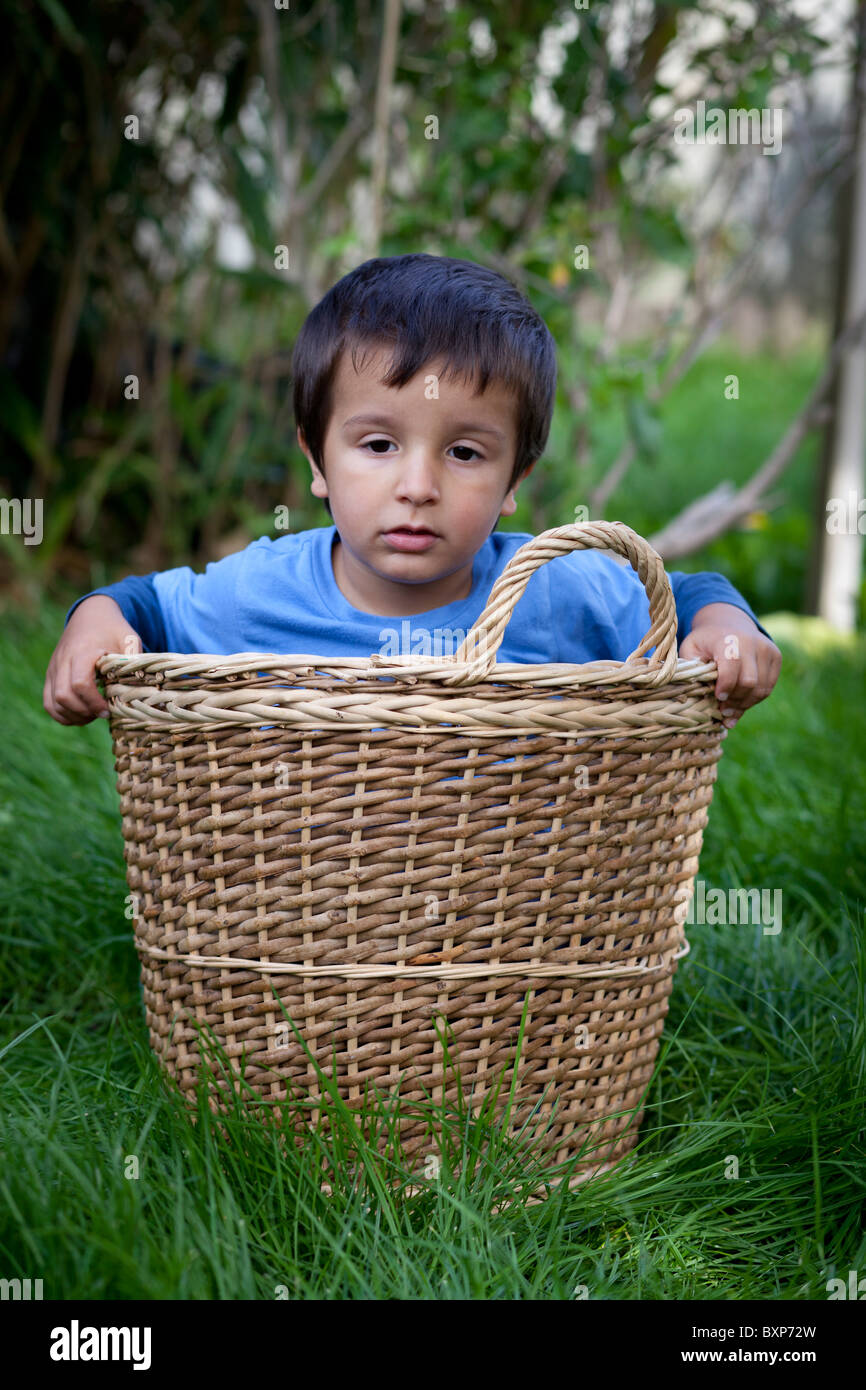 child in a washing basket Stock Photo Alamy
