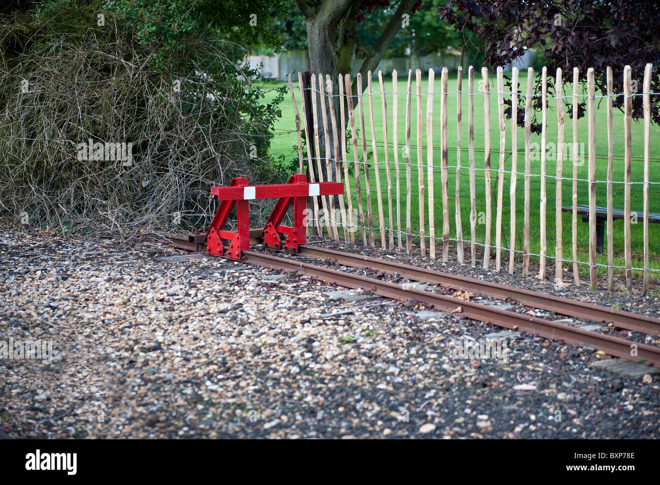 Red Railway Buffer on a narrow-gauge railway in Kent Stock Photo
