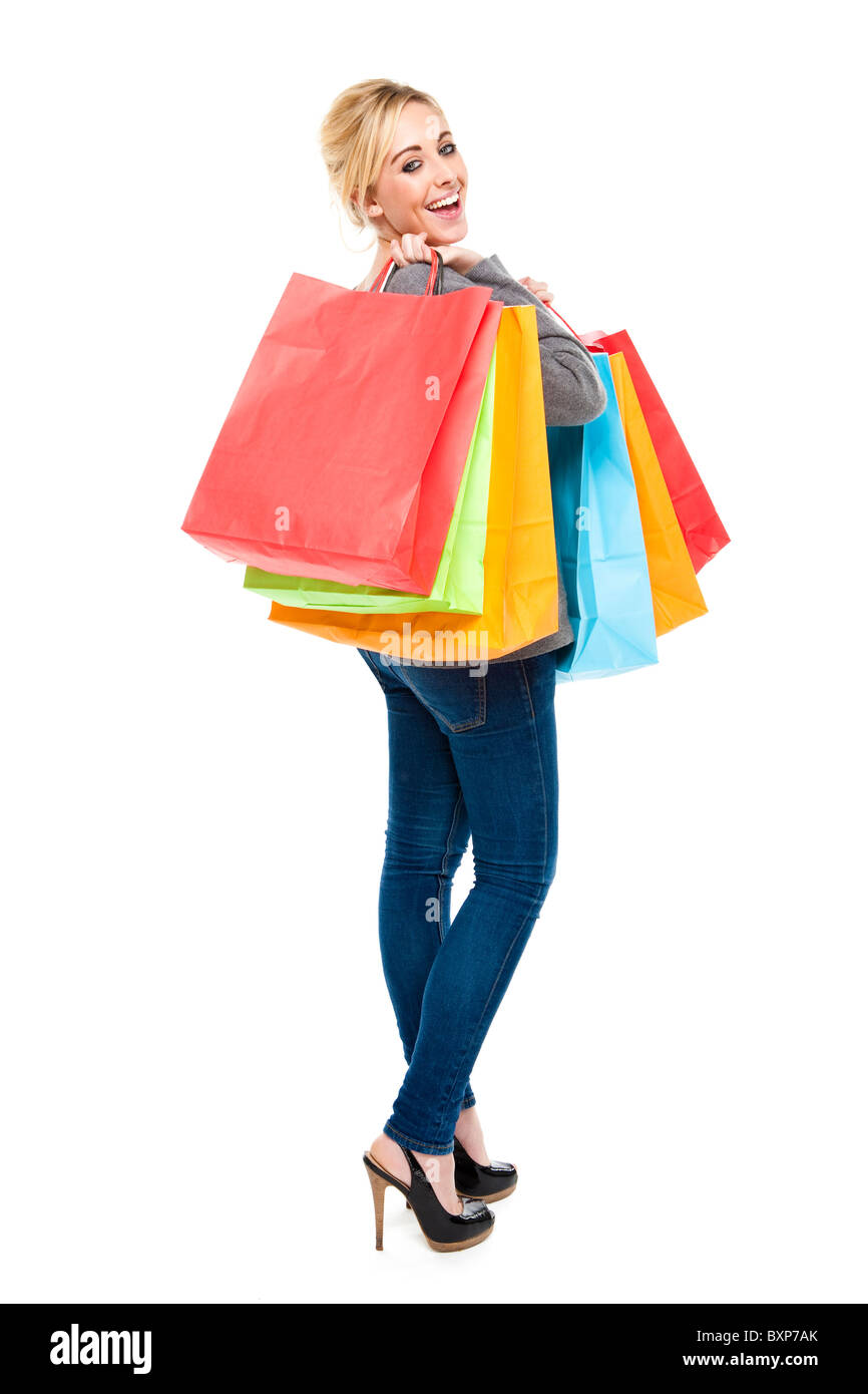 Attractive Young Blond Woman Carrying Lots of Multi-Colored Shopping Bags Looking Happy and Excited Stock Photo