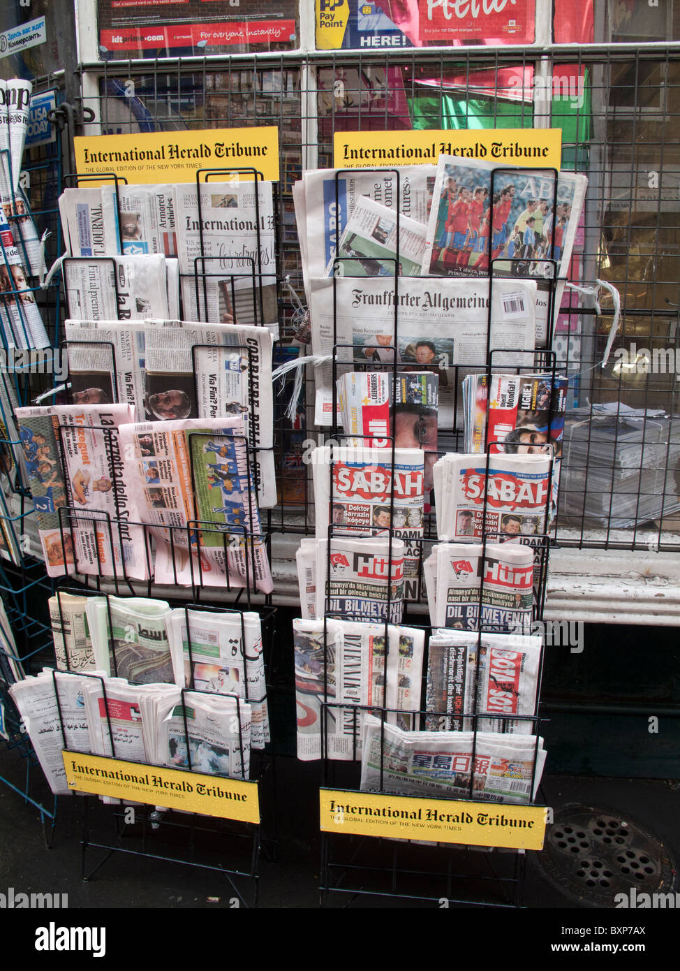 International newspapers on sale at news agents Stock Photo