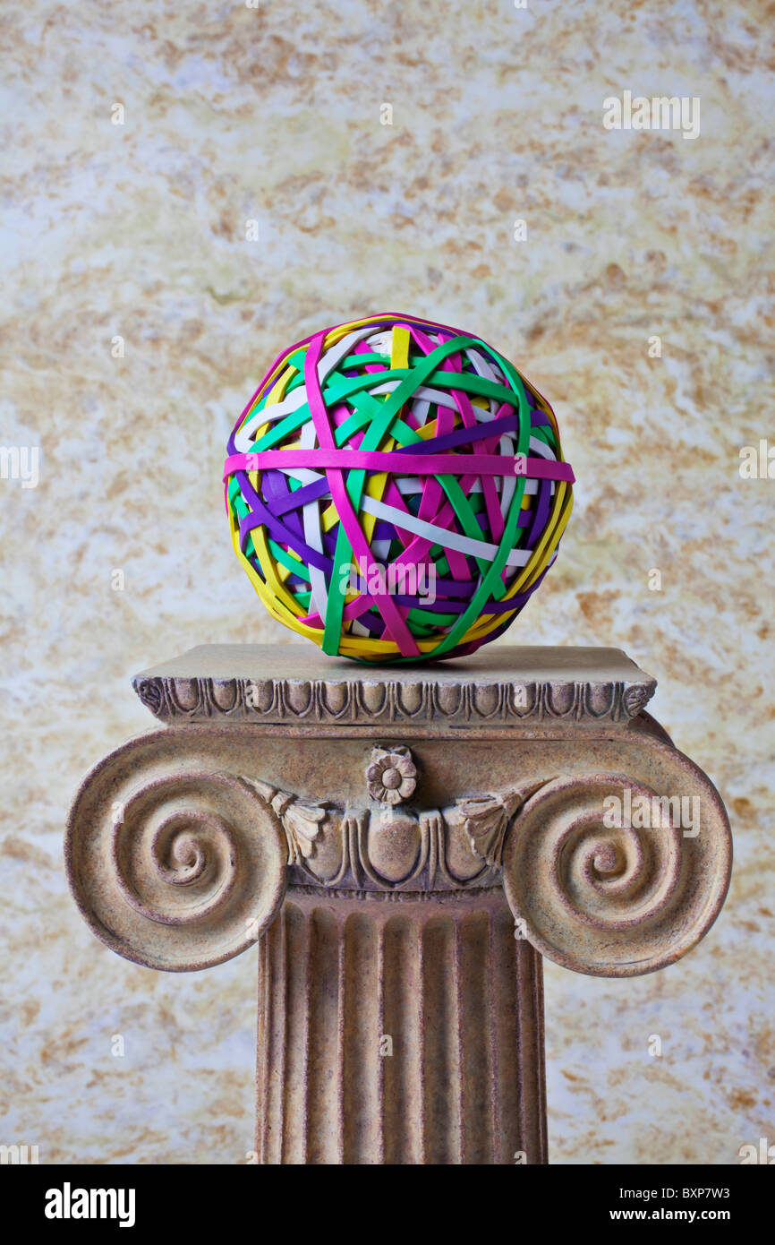 Rubber band ball on pedestal Stock Photo