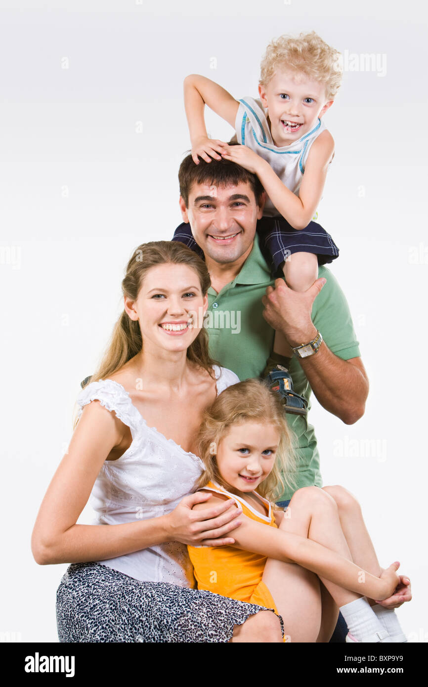 Photo of happy family of woman, man, boy and girl together Stock Photo ...