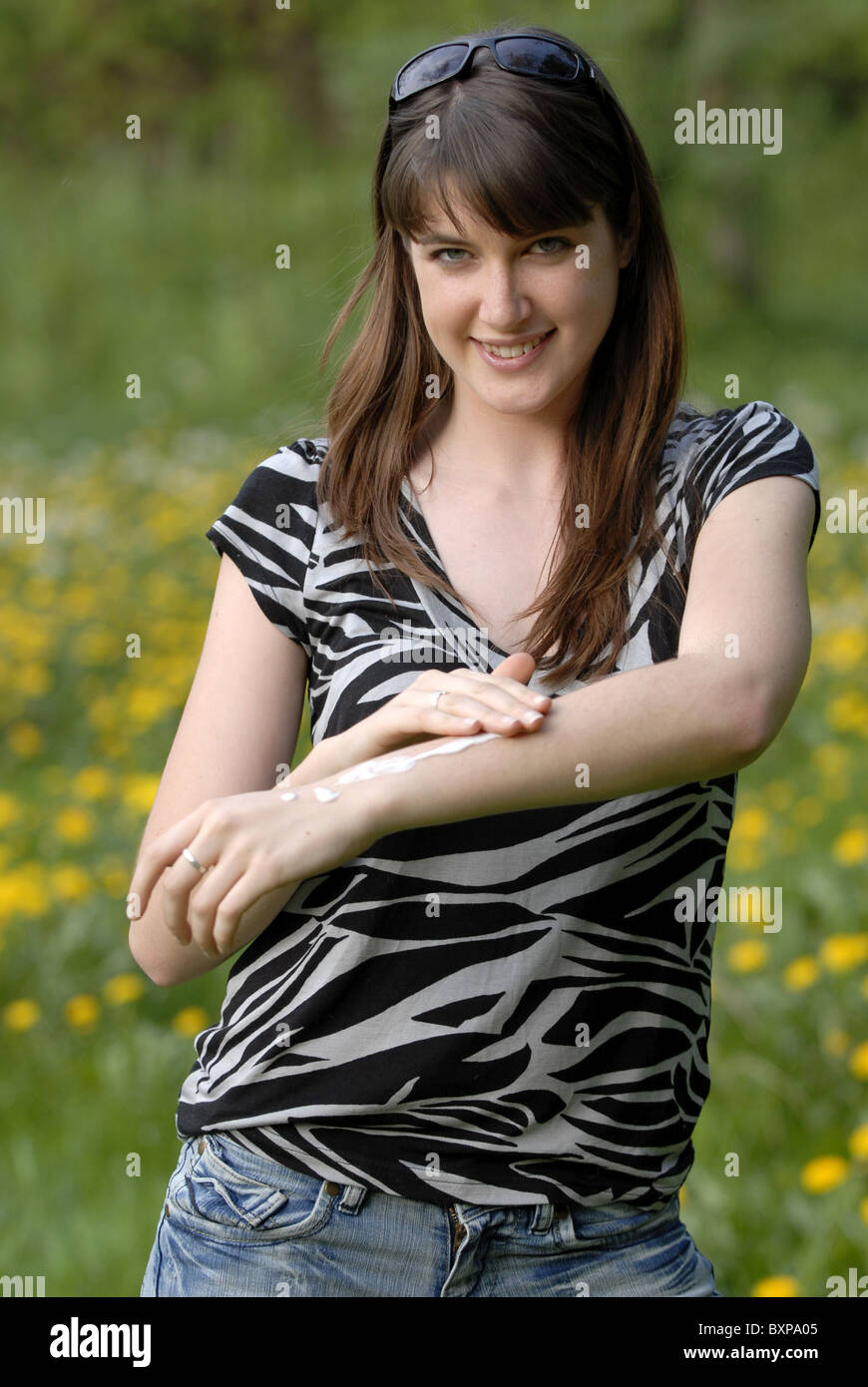 Young woman getting creamed Stock Photo