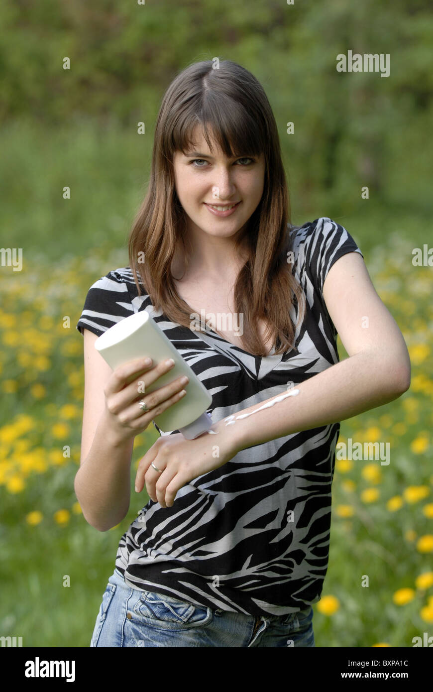 Young woman getting creamed Stock Photo