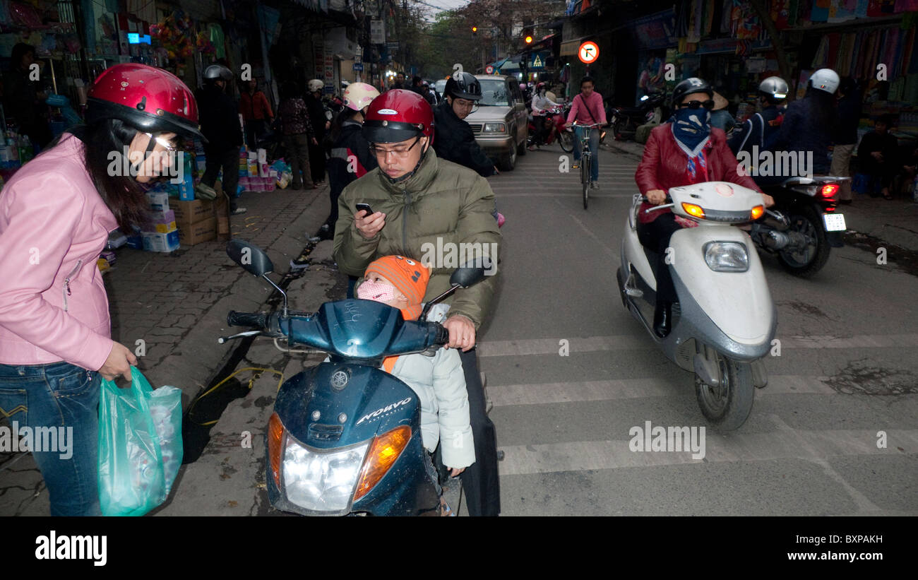 Motorscooters on a busy Hanoi street Stock Photo