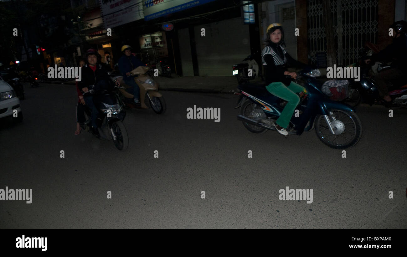 Motorscooters on a busy Hanoi street Stock Photo