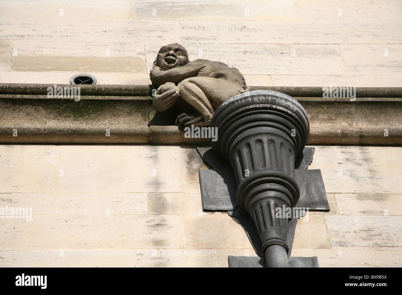 Cheeky gargoyle below the Magdalen College Great Tower in Oxford Stock Photo