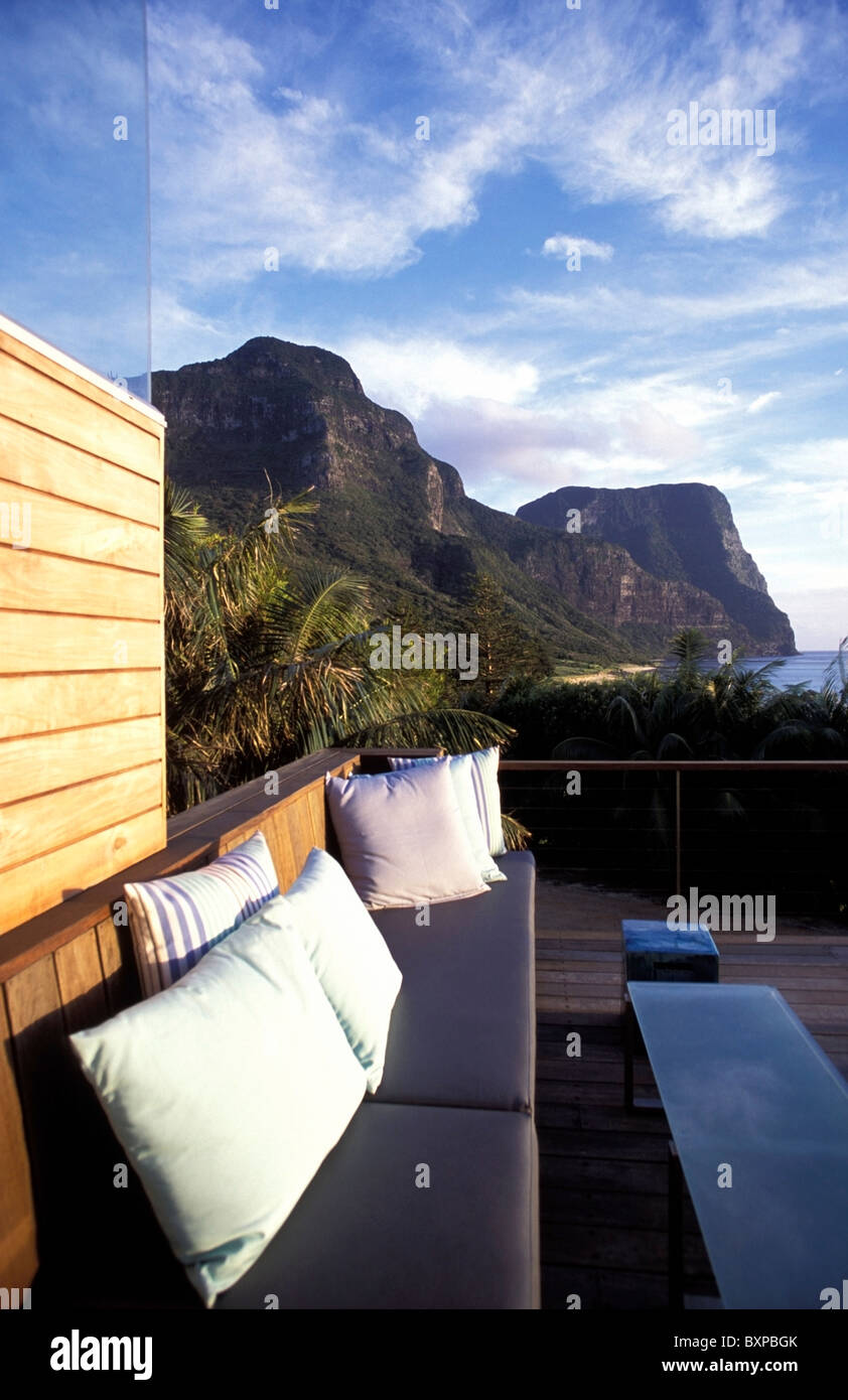 Padded Bench On Patio Beside Mountains Lidgbird And Gower Stock Photo