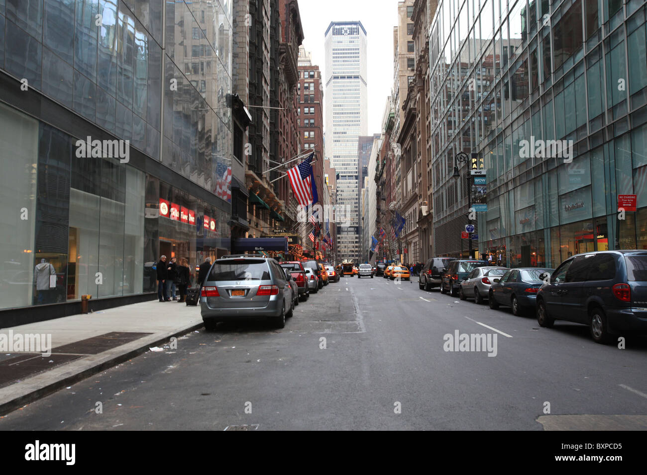 Vehicles parking on both sides of a oneway street in Manhattan, New
