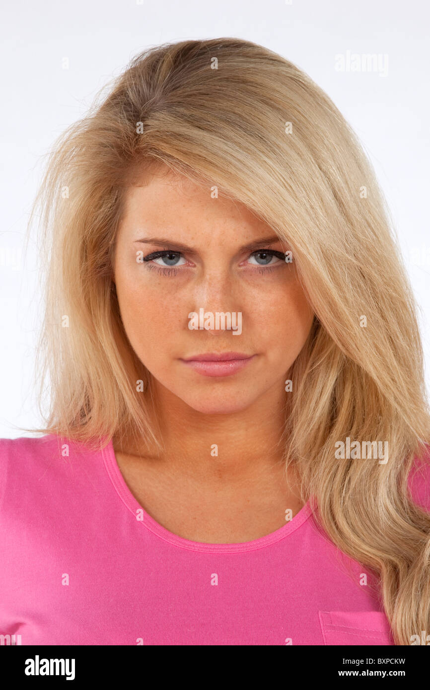 Young blond woman with serious expression on her face Stock Photo