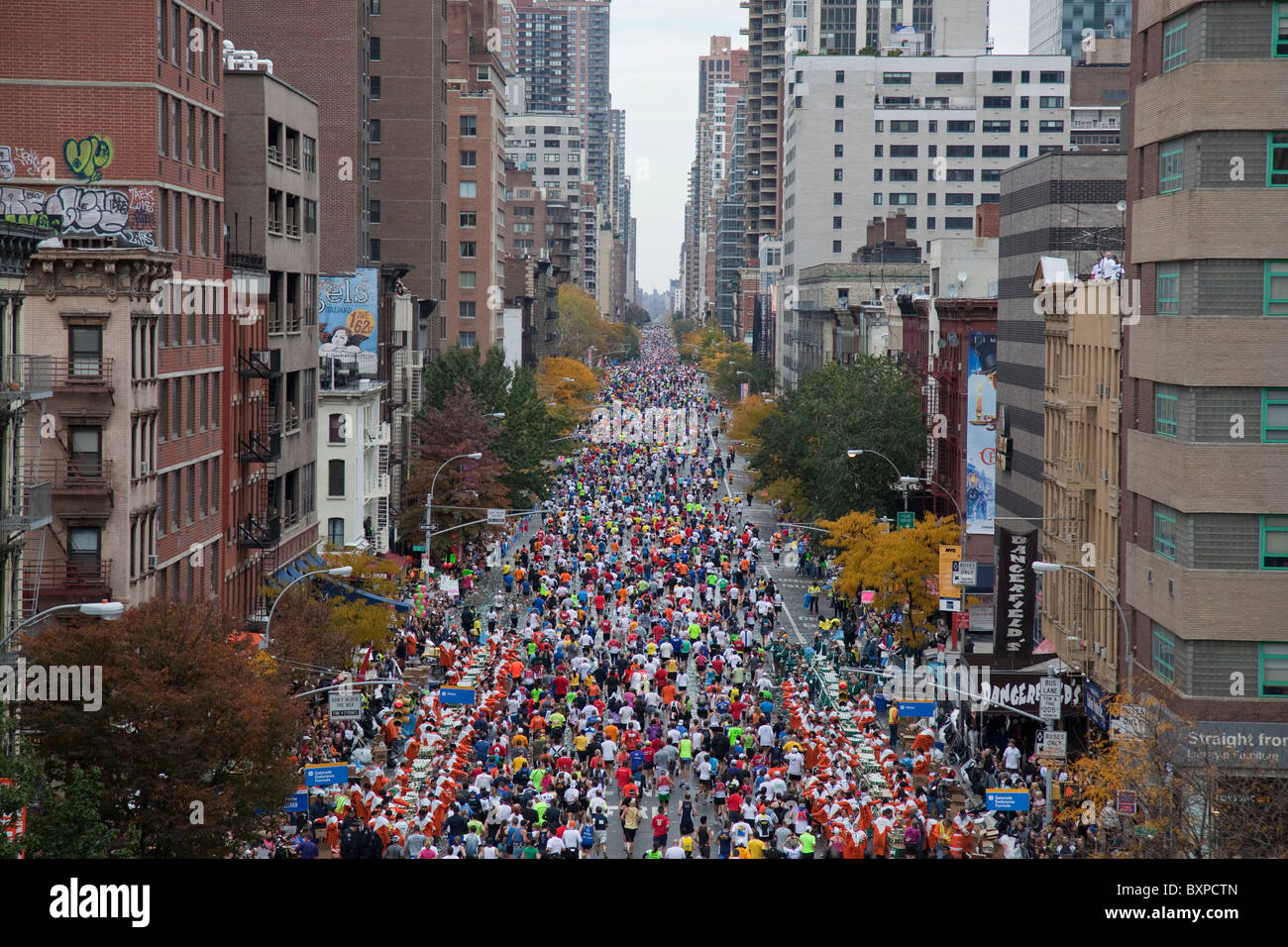 Runners competing on First Avenue during 2009 New York City Marathon ...