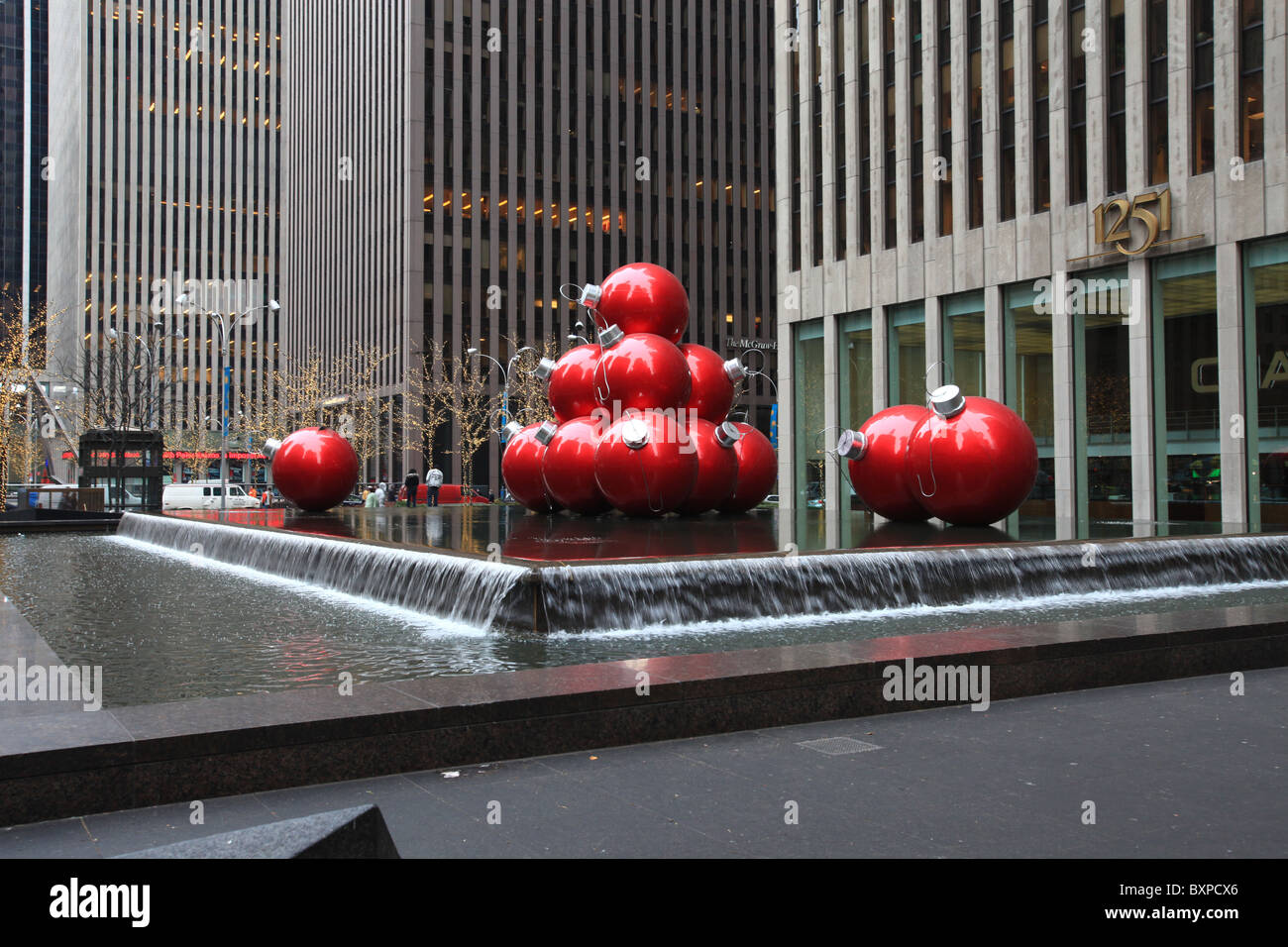 Giant Christmas ornament balls outside Rockefeller center on Sixth Ave, New York city, in Christmas 2010 Stock Photo