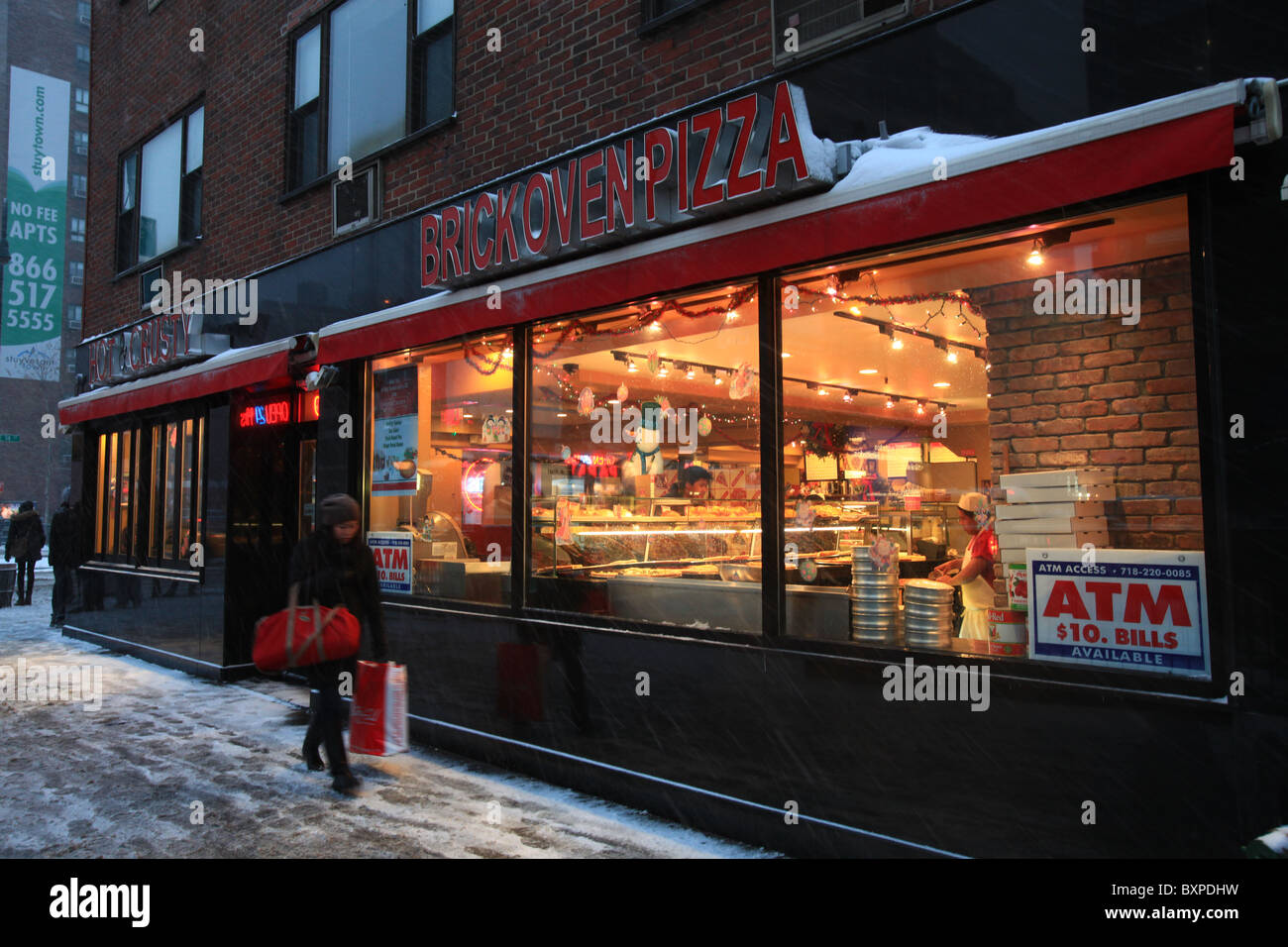 Brick oven pizza store on Third avenue, New York city, in the great blizzard that came in Christmas 2010 Stock Photo