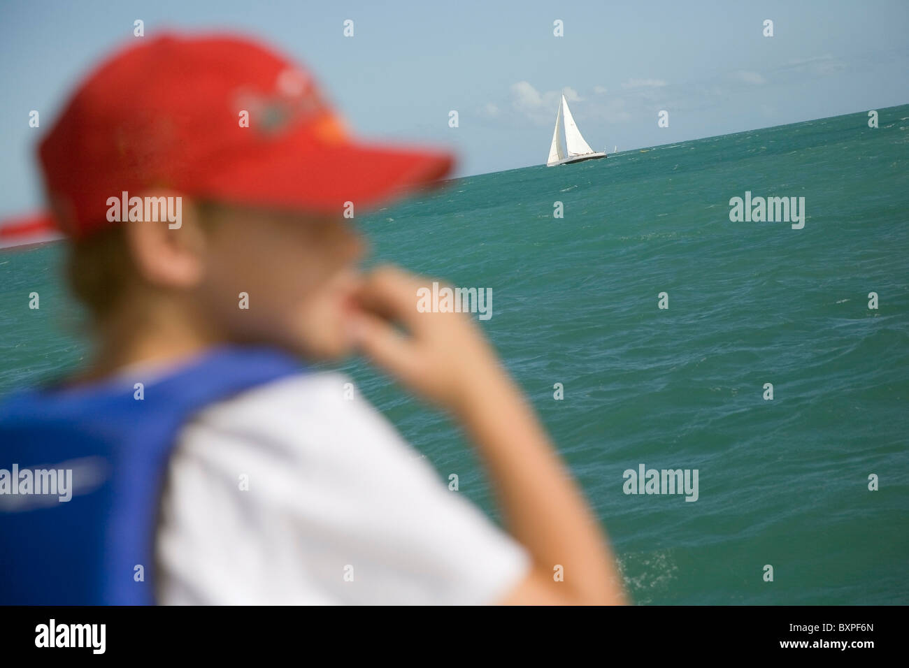 Boy In Baseball Hat And Sail Boat Stock Photo Alamy