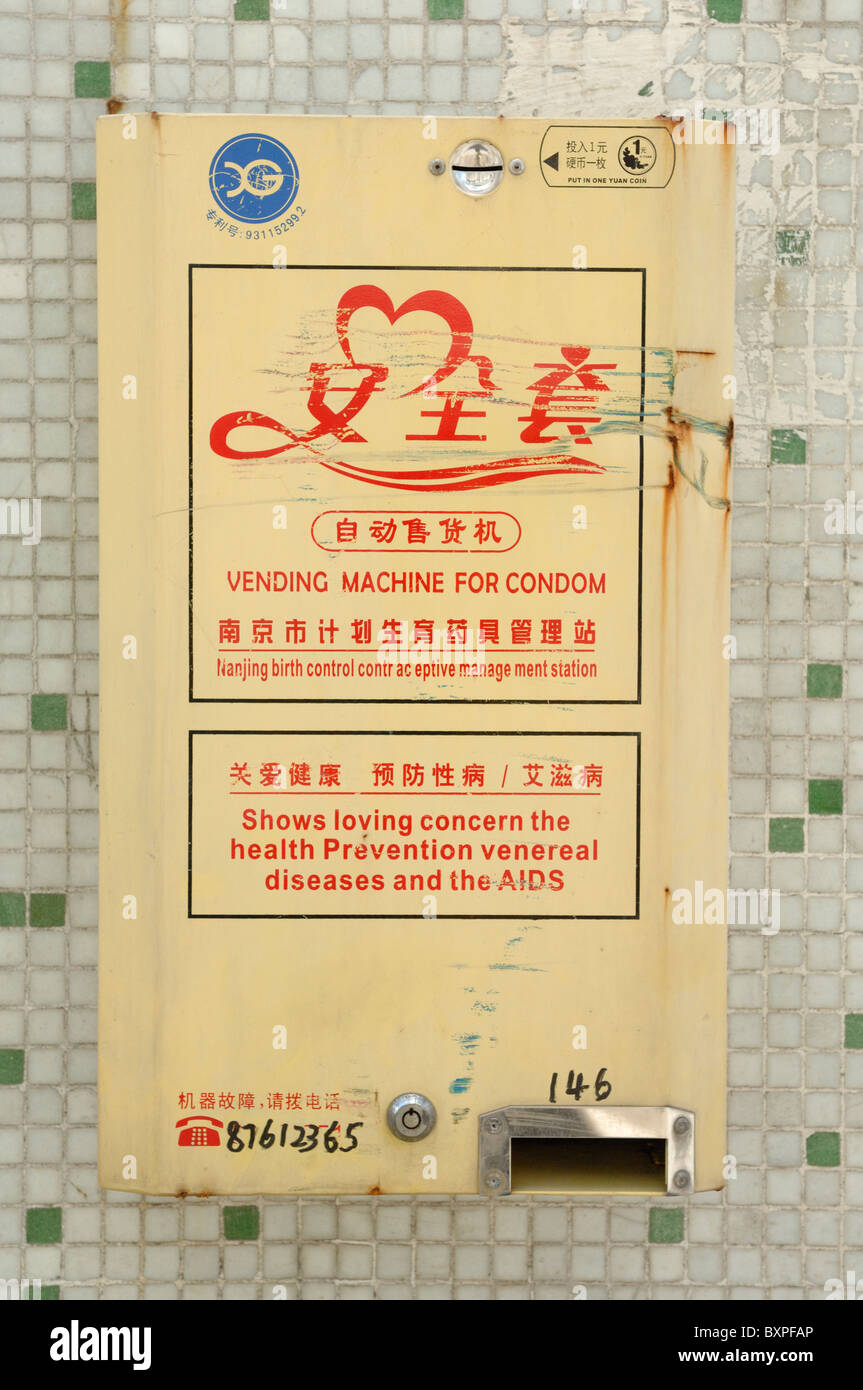 A wall mounted Chinese condom vending machine in China Stock Photo