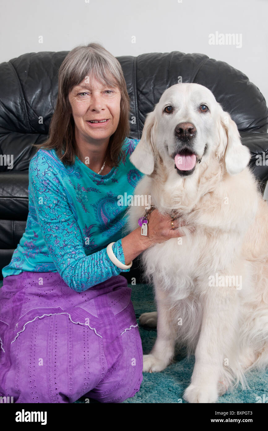 portrait woman with her golden retriever at home Stock Photo - Alamy