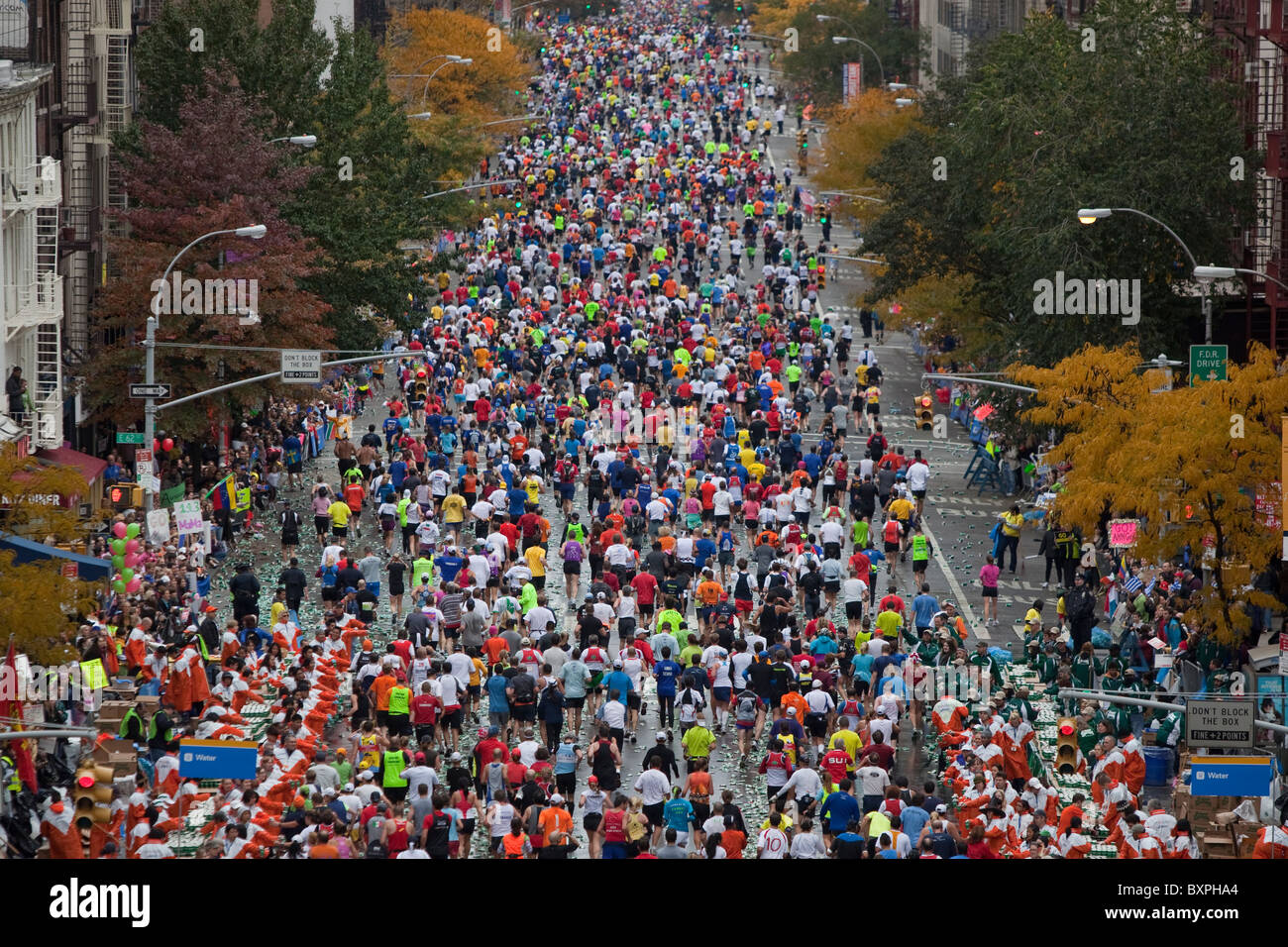 Runners competing on First Avenue during 2009 New York City Marathon ...