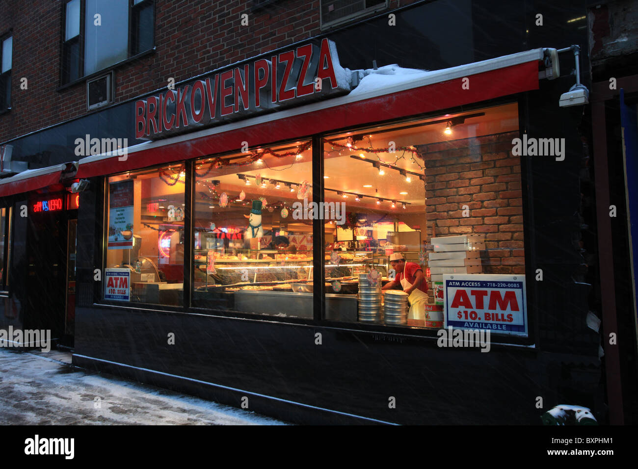 Brick oven pizza store on Third avenue, New York city, in the great blizzard that came in Christmas 2010 Stock Photo