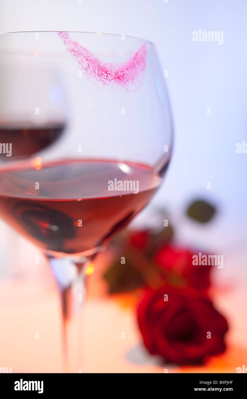 Ti ske Alperne Romance is implied in an image of a wine glass with lipstick marks and red  roses Stock Photo - Alamy