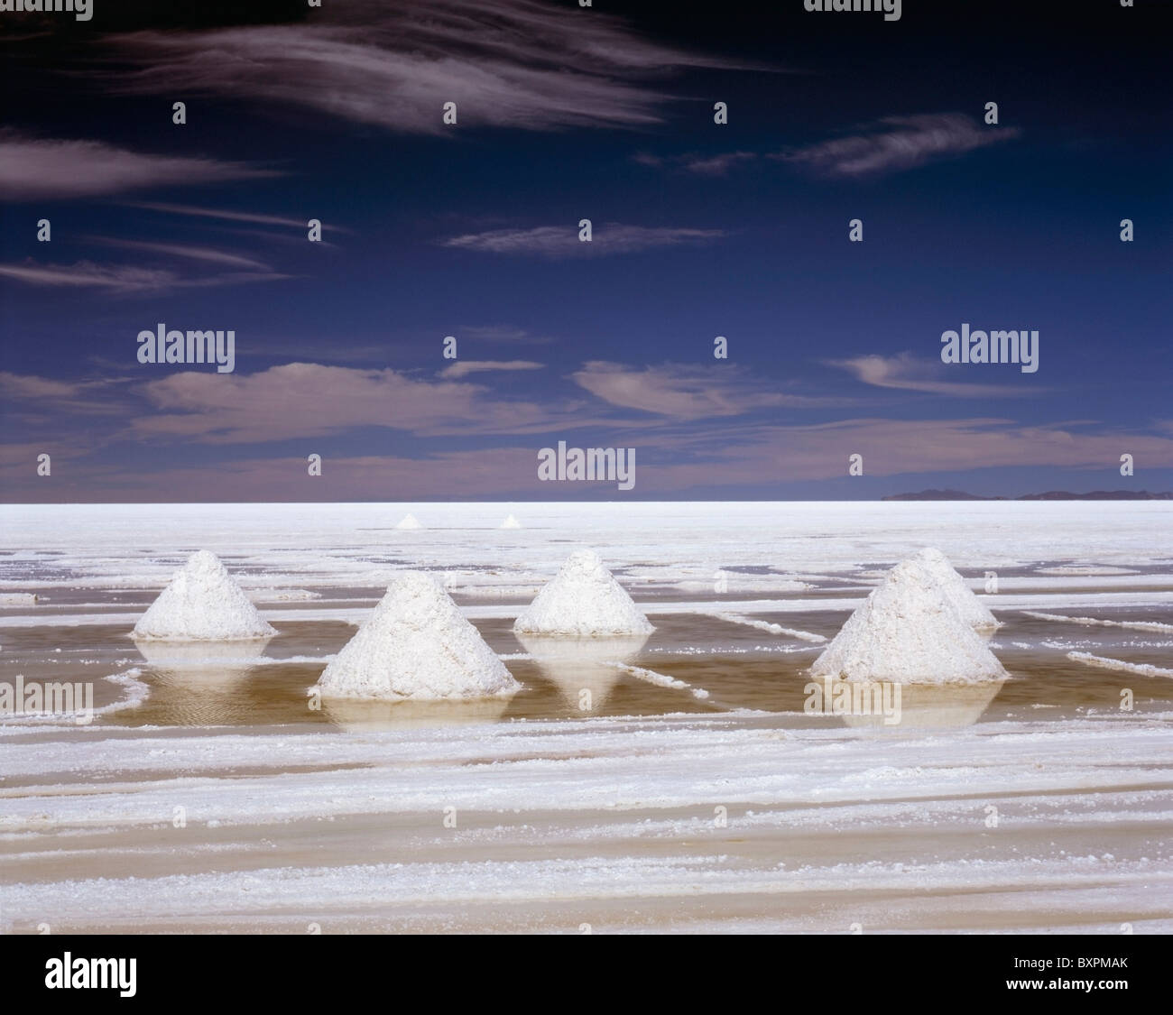 White Piles Of Salt In Stark Landscape Stock Photo