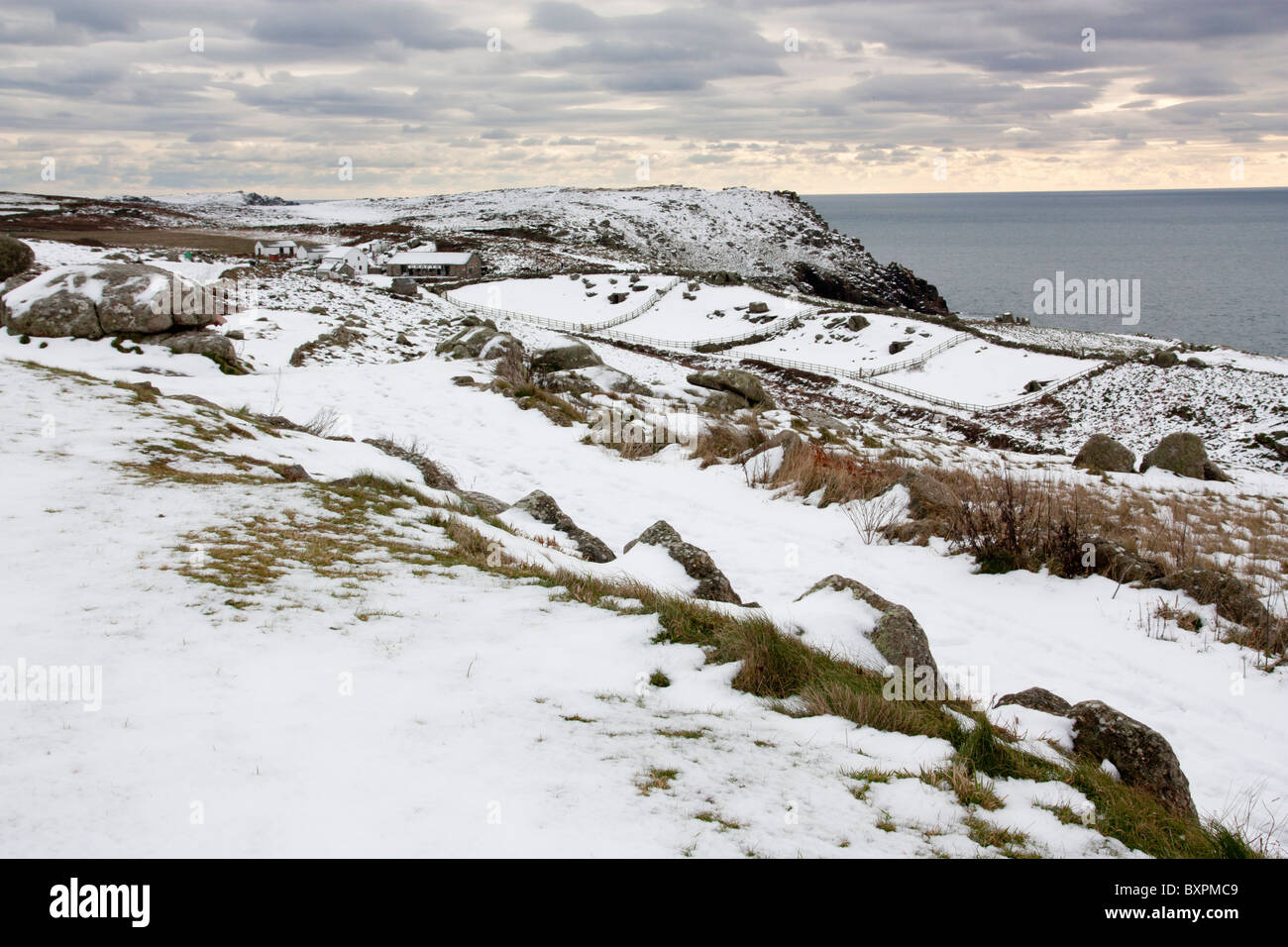 Snow at lands end cornwall england uk stock photo alamy