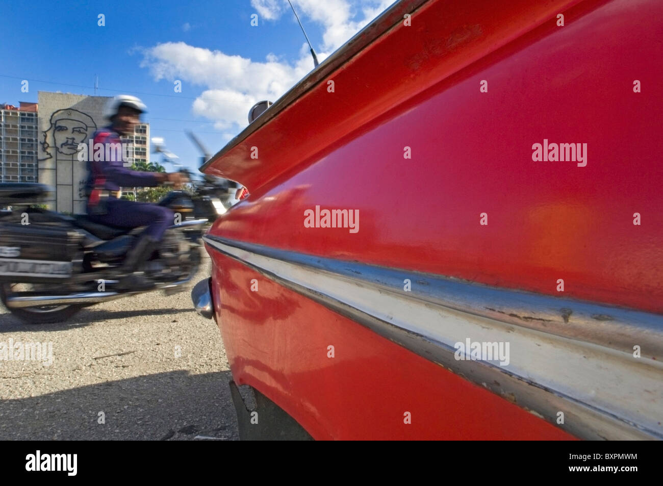 A Blurred Police Motorcyclist Passing The Che Guevara Sculpture In Plaza De La Revoluciûn. Stock Photo