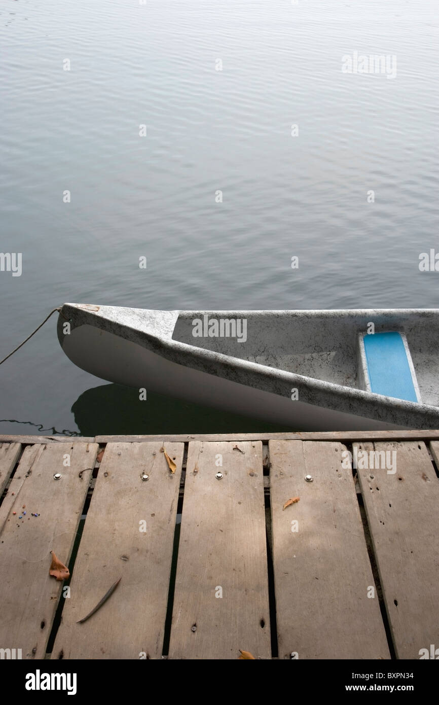 Canoe Tied To Jetty Stock Photo