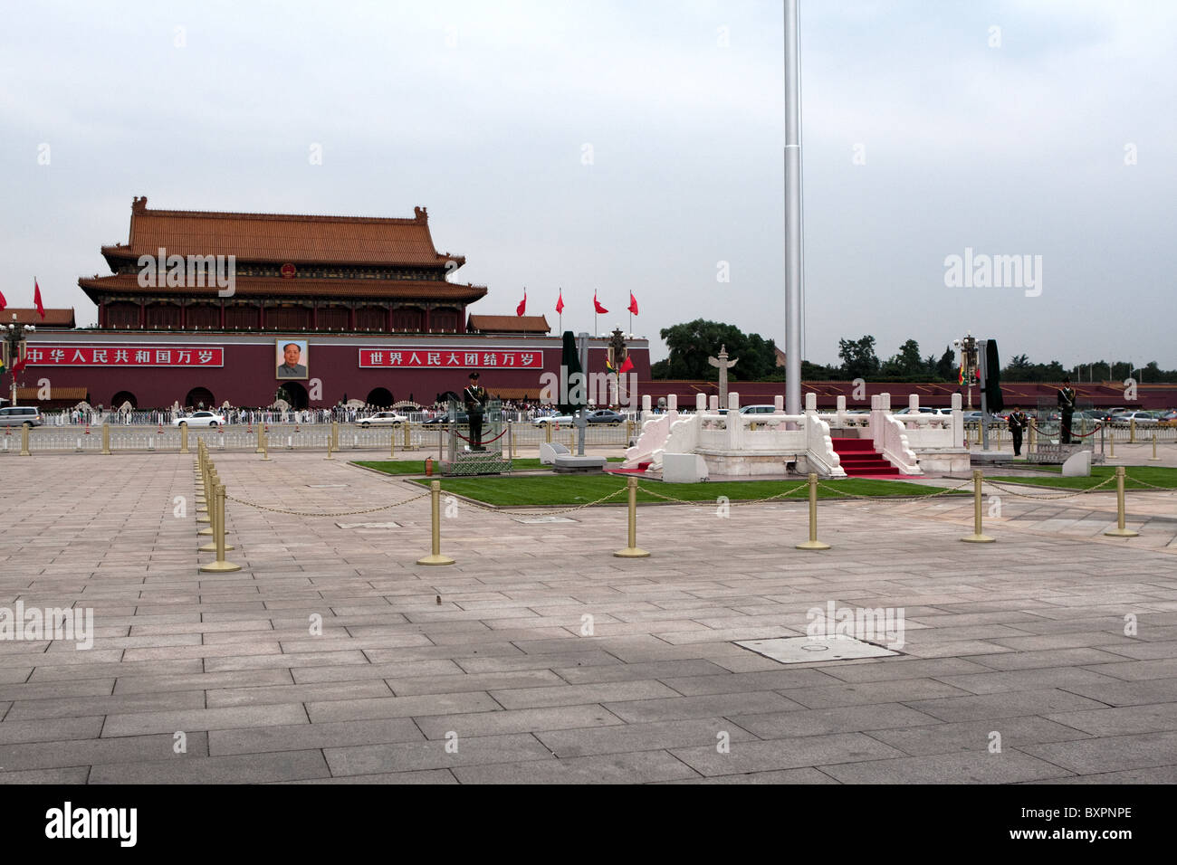 Entrance to The Forbidden City, GuGong, Beijing, China, + Mao Zetung + flag pole + soldiers Stock Photo