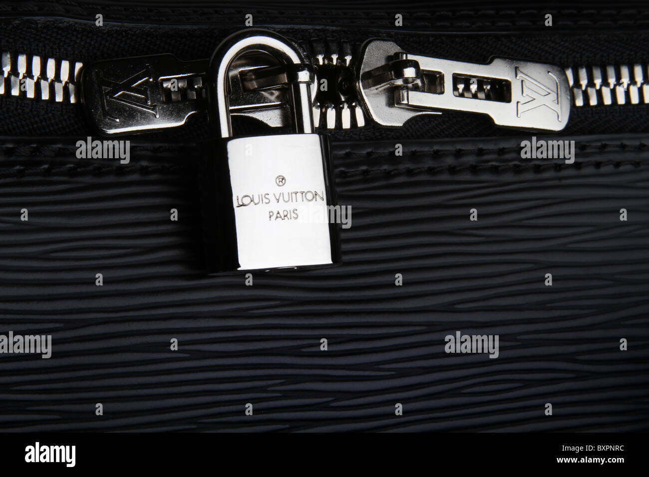 Louis Vuitton stainless steel lock & zipper Stock Photo