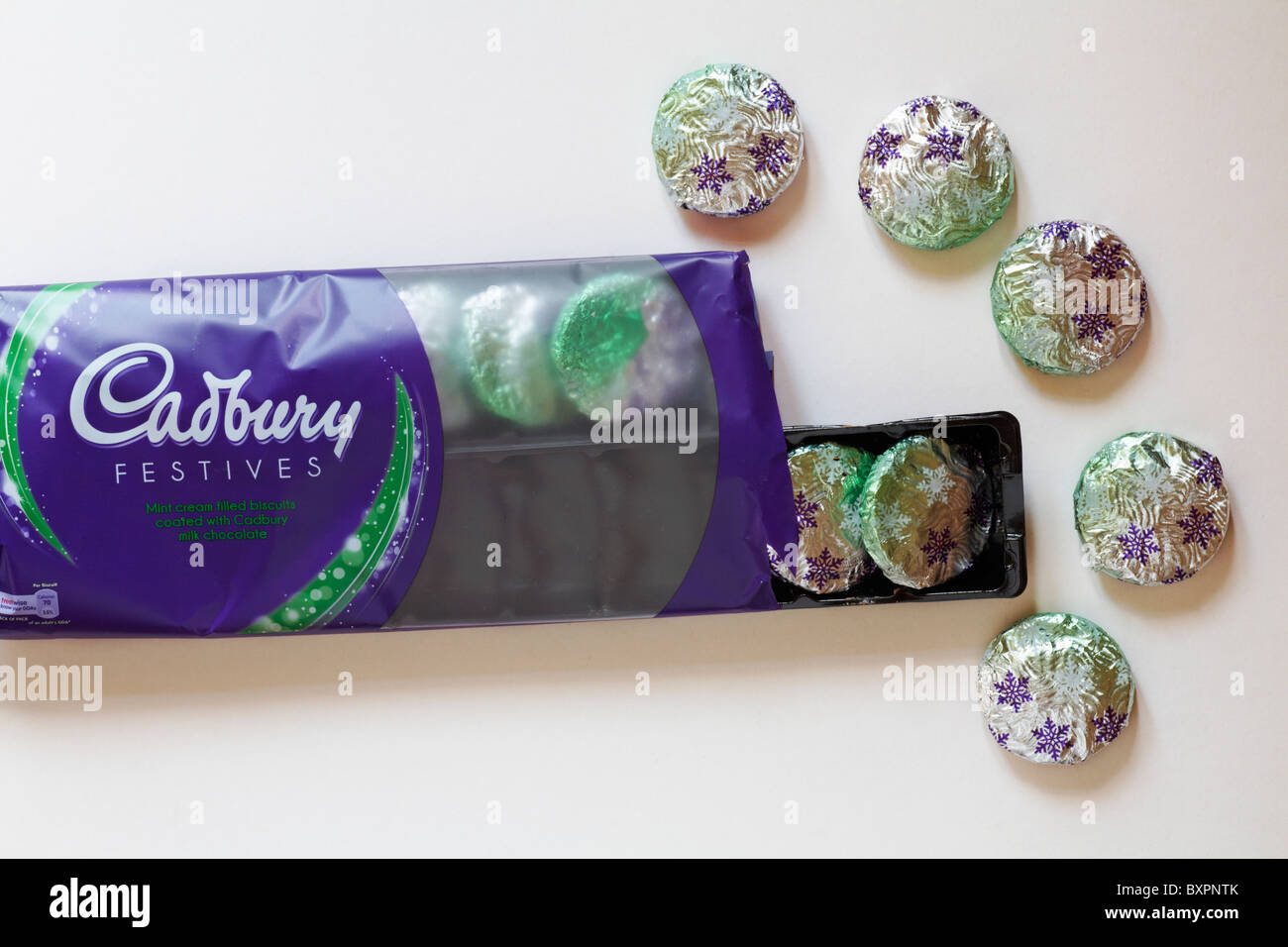 Cadbury Festives mint cream filled biscuits coated with Cadbury milk chocolate set on white background Stock Photo